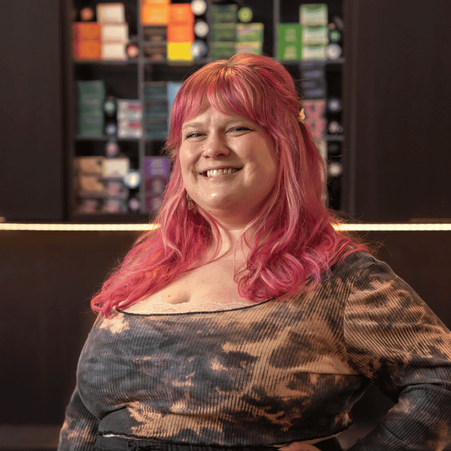 Portrait of Alaina (She/Her), a professional stylist at Rebel Hair, showcasing their expertise and style.