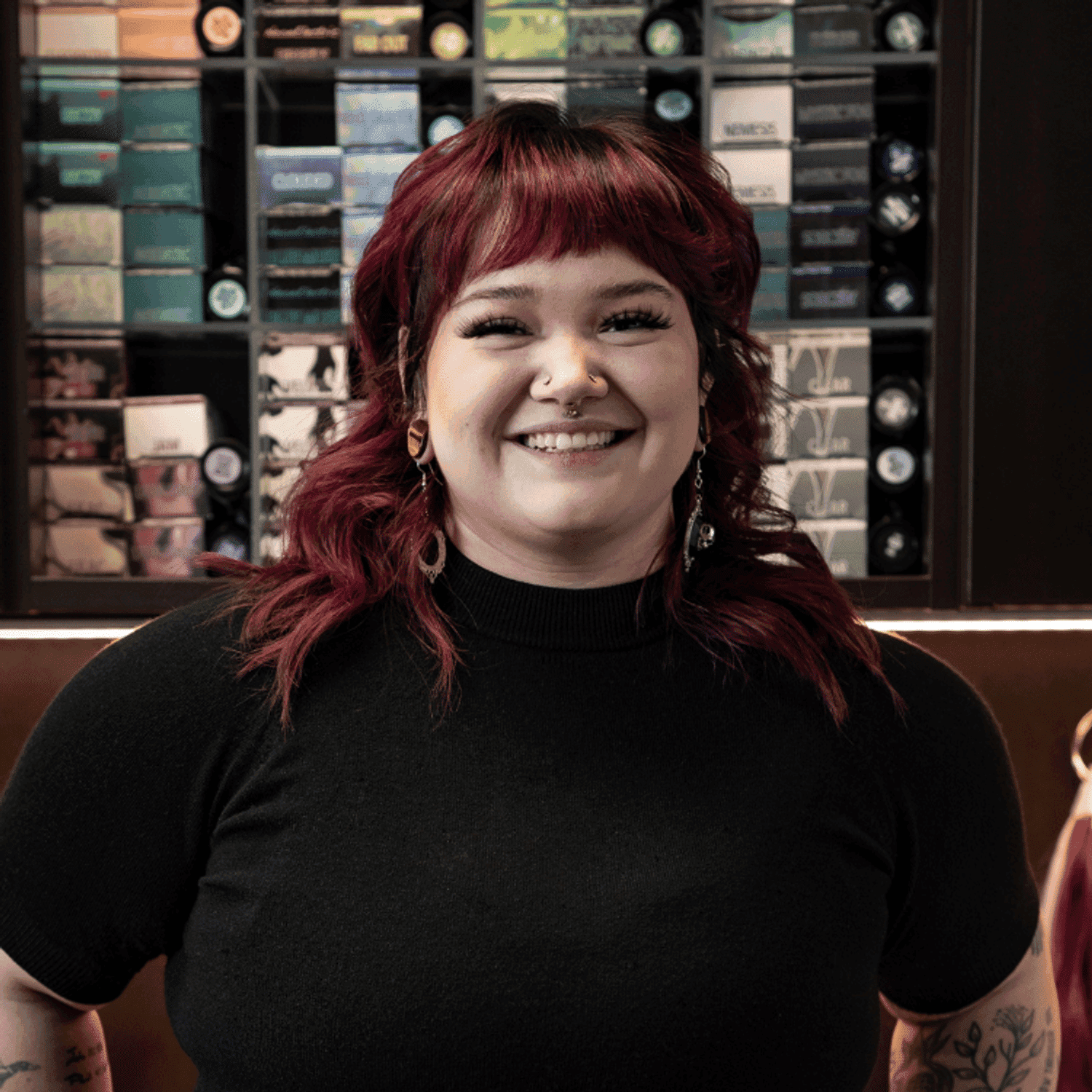 Portrait of María (She/Her), a professional stylist at Rebel Hair, showcasing their expertise and style.