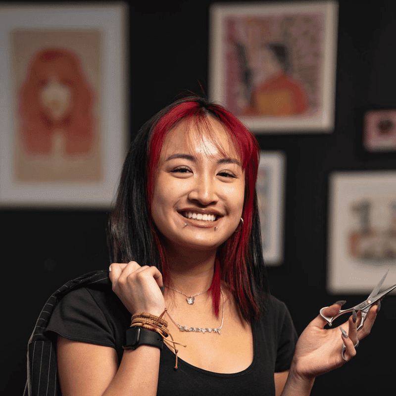 Portrait of May (She/Her), a professional stylist at Rebel Hair, showcasing their expertise and style.